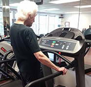 Resident woman using a treadmill.