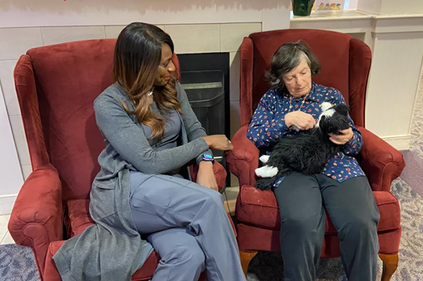 collington resident with robotic cat