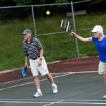 Two residents playing pickleball.