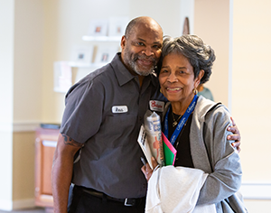 collington-resident-hugging-maintenance-man