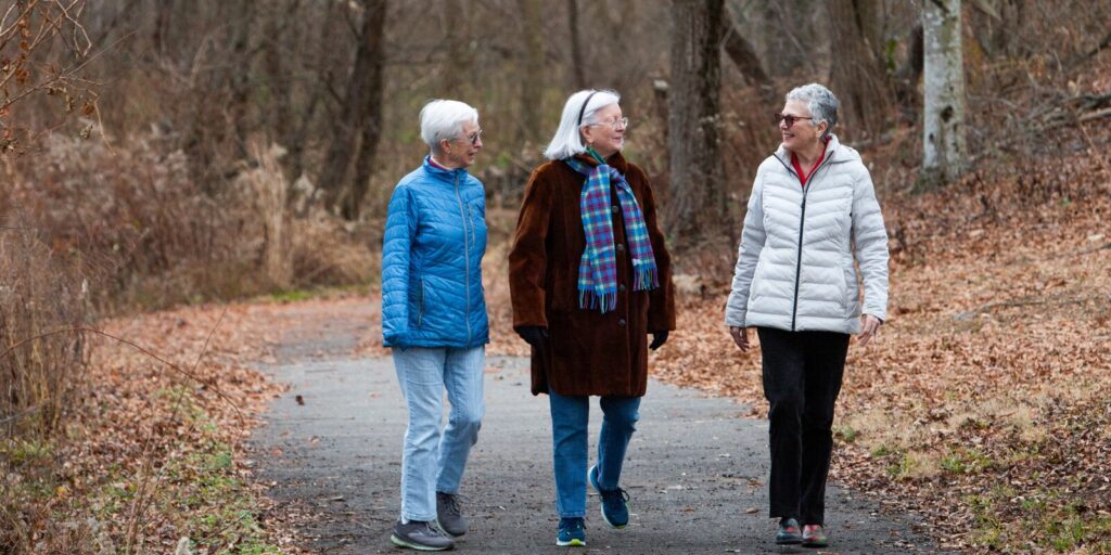 Residents walking along path during the fall